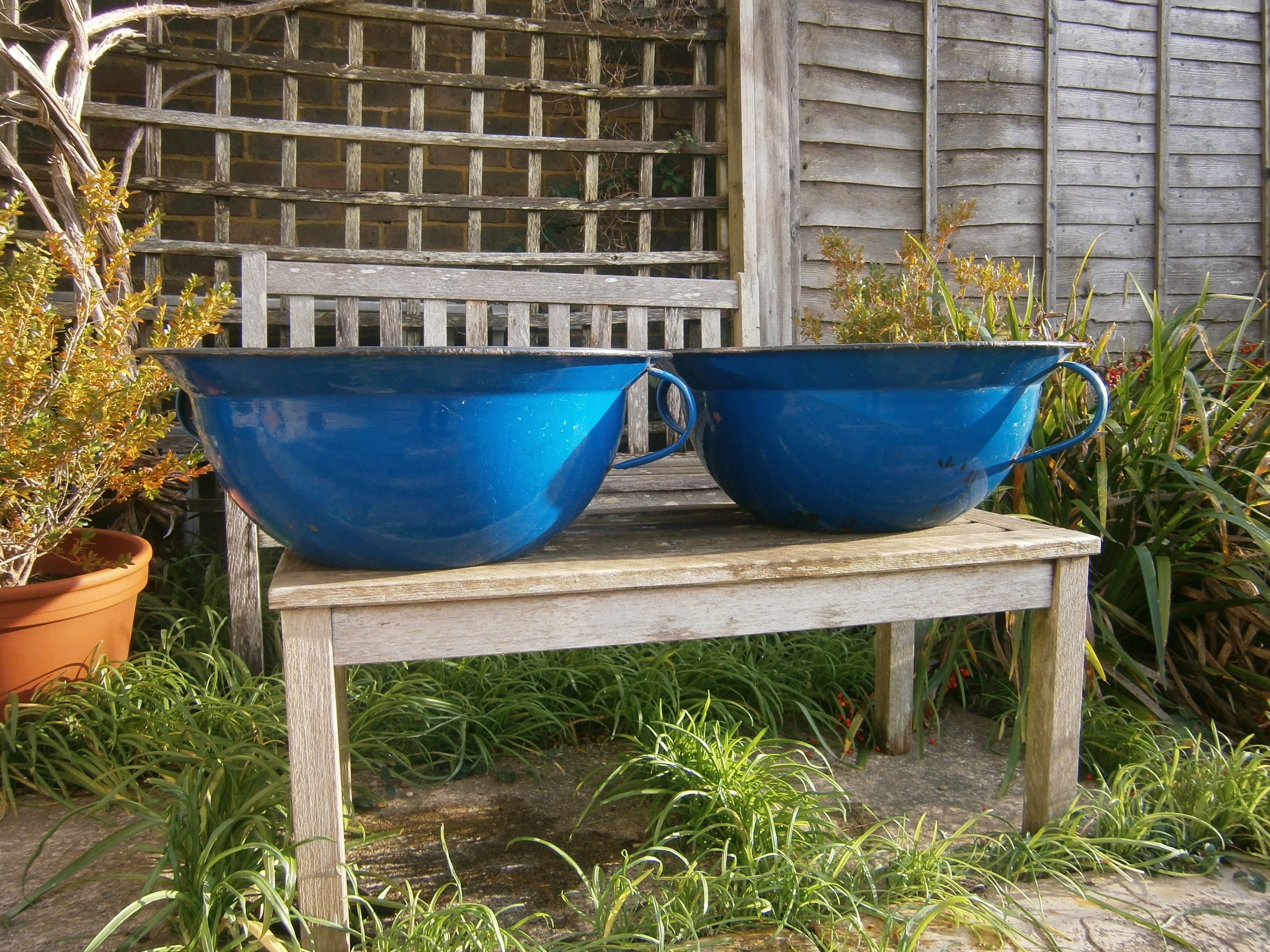 A pair of French enamel two-handled pans, 57cm diameter, 22cm high
